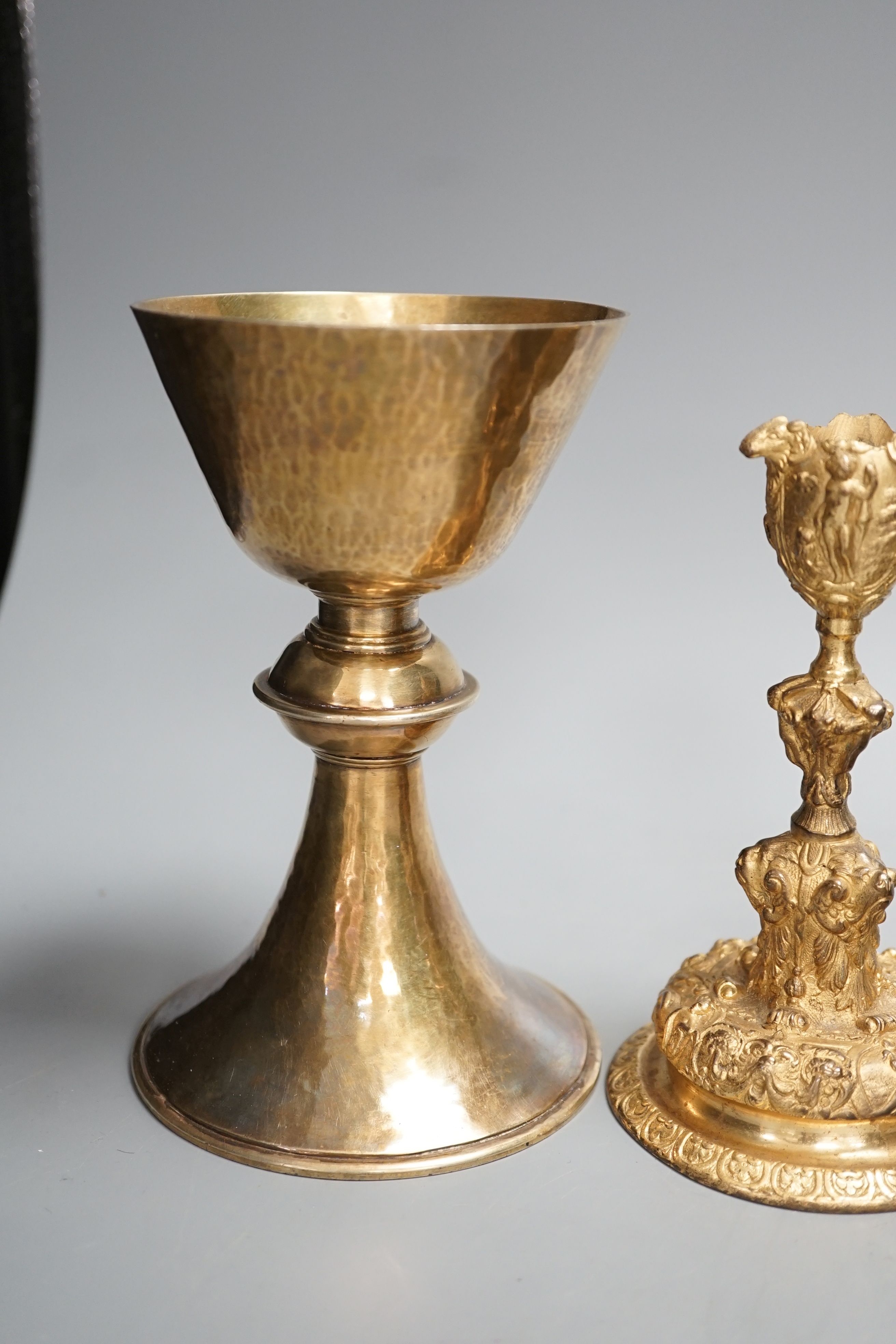 A decorative ormolu inkwell, 20cm high, a Baroque style candlestick, a chalice stamped W IV, together with a faux tortoiseshell pot (4)